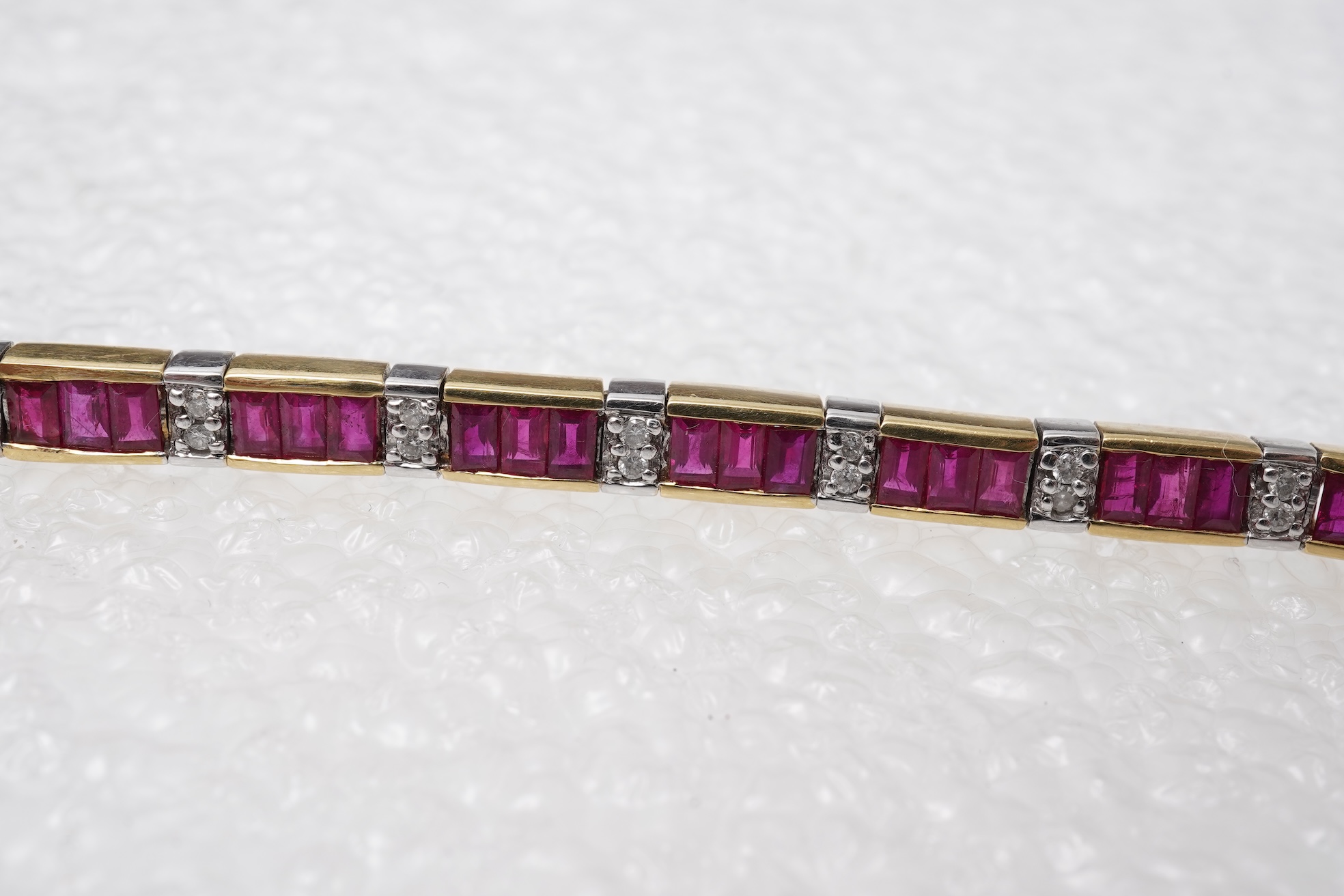 A ruby and diamond bracelet and pendant